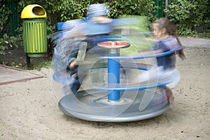 Playground with kids and carousel