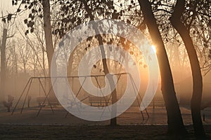 Playground in morning fog