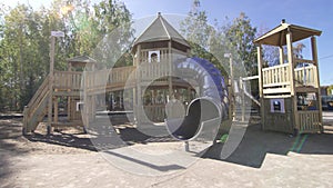 Playground with multicoloured equipment awaits children