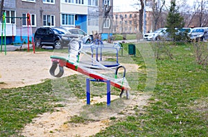 Playground during quarantine - all structures are wrapped with stretch film. swing, sandbox. insulation for children outdoors