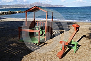 Playground seesaw and summerhouse