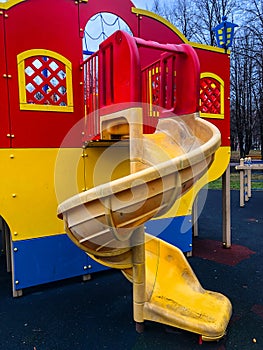 Playground, slides, swings, a ladder in city park