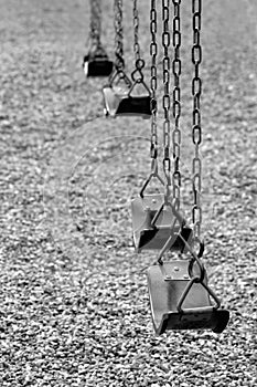 Playground swings in black and white