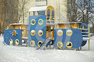 Playground in winter without children. Play area in yard in snow. Blue Blue Coloring Design for Baby Play