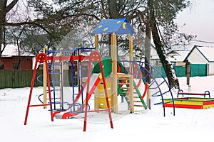 Playground in the winter. Children`s playground in the snow