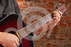 Playing on acoustic guitar