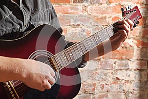 Playing on acoustic guitar