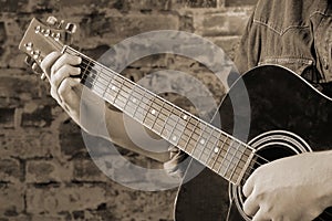 Playing on acoustic guitar