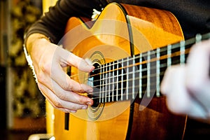 Playing an acoustic guitar