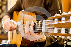 Playing an acoustic guitar