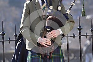 Playing bagpipes - landscape