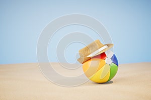 playing with a ball on the beach. an inflatable multi-colored ball with a hat on a sandy beach. 3D render