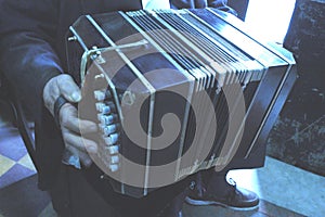 Playing the bandoneon, traditional tango instrument, Argentina