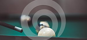 playing biliard in a pool.