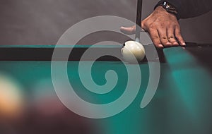 playing biliard in a pool.