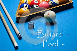 Playing billiard. Billiards balls and cue on billiards table. Bi