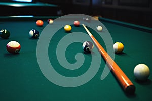 Playing billiard. Billiards balls and cue on green billiards table. Billiard sport concept.