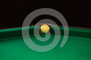 Playing billiard. Billiards balls and cue on green billiards table. Billiard sport concept. Pool billiard game. Russian pyramid