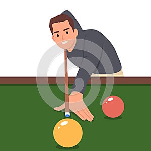 Playing billiard. Close up shot of a man playing billiard