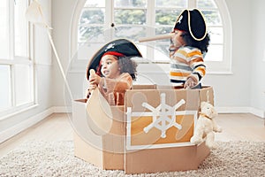 Playing, box boat and pirate children role play, fantasy imagine or pretend in cardboard container. Telescope, fun home