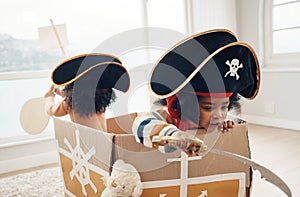 Playing, box ship and pirate children role play, fantasy imagine or pretend in cardboard container. Creative boat, fun