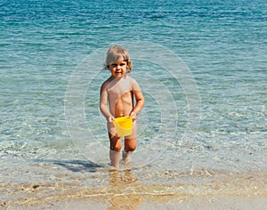 Playing with bucket of water