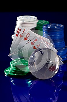 Playing card chips, dice, and globe