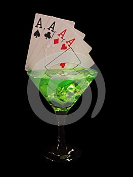 Playing card in a cocktail glass on black background. casino series