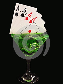 Playing card in a cocktail glass on black background. casino series