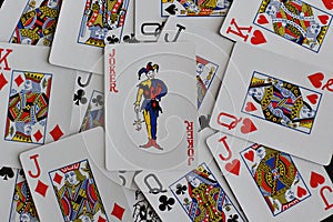 Playing card joker on the background of scattered cards