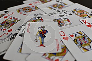 Playing card joker on the background of scattered cards