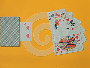 Playing cards 54 pieces on a yellow background.