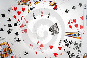 Playing cards background. 4 aces on the background made of playing cards. Isolalated aces