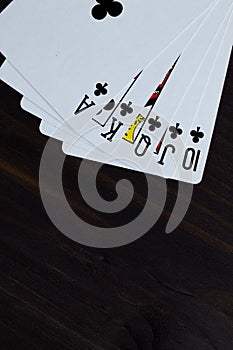 Playing cards on black background. Royal flush