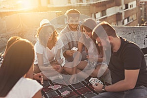 Playing cards on a building rooftop