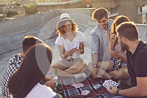 Playing cards on a building rooftop