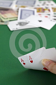 Playing cards in the casino.hand shows a two aces.