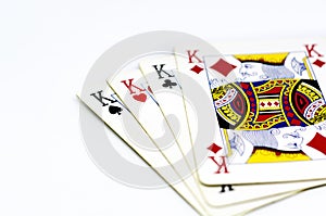 Playing cards depicting the four kings isolated on a white background