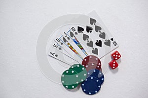 Playing cards, dice and casino chips on white background