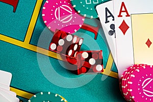 Playing cards, dice and colored poker chips from above on poker table at the casino. The concept of gambling, betting