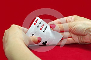 Playing Cards. Poker and aces. Red background
