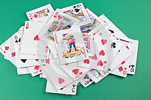 Playing cards on green background