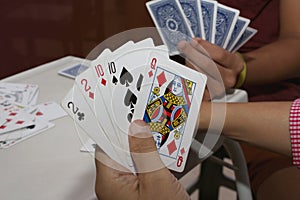 Playing cards in hand