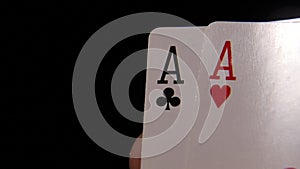 Playing cards in hand. Two aces. Playing poker