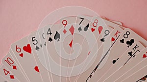 Playing cards - isolated on pink background