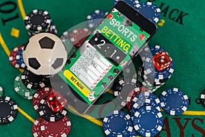 Playing cards, poker chips, and dice, the smartphone. Online casino concept. Gambling. Background.