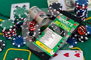 Playing cards, poker chips, and dice, the smartphone. Online casino concept. Gambling. Background.