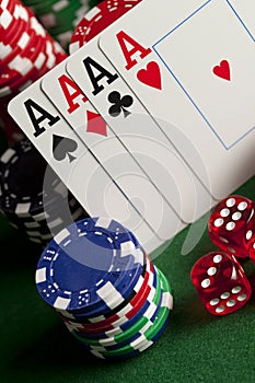 Playing cards, poker chips, and dices on table