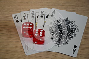 Playing cards and poker chips on grey background