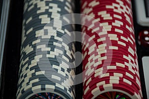 Playing cards and poker chips on grey background